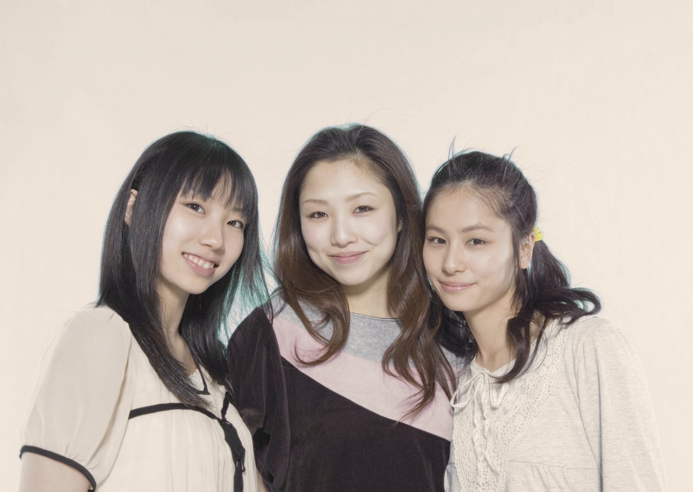 Three friends smiling together
