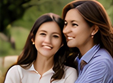 Mother and daughter cheek to cheek